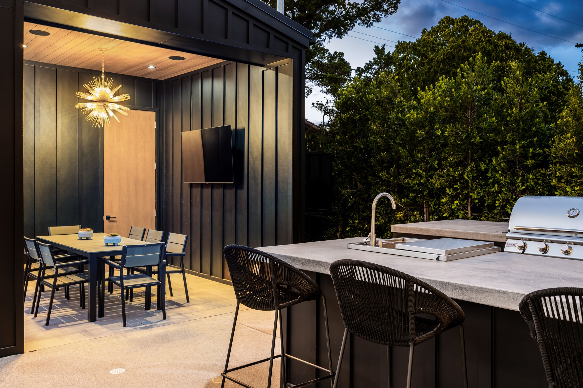 Modern outdoor kitchen and dining area