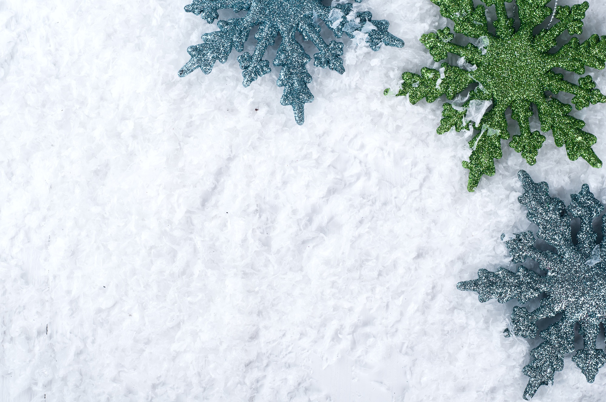 colored snowflakes on snow
